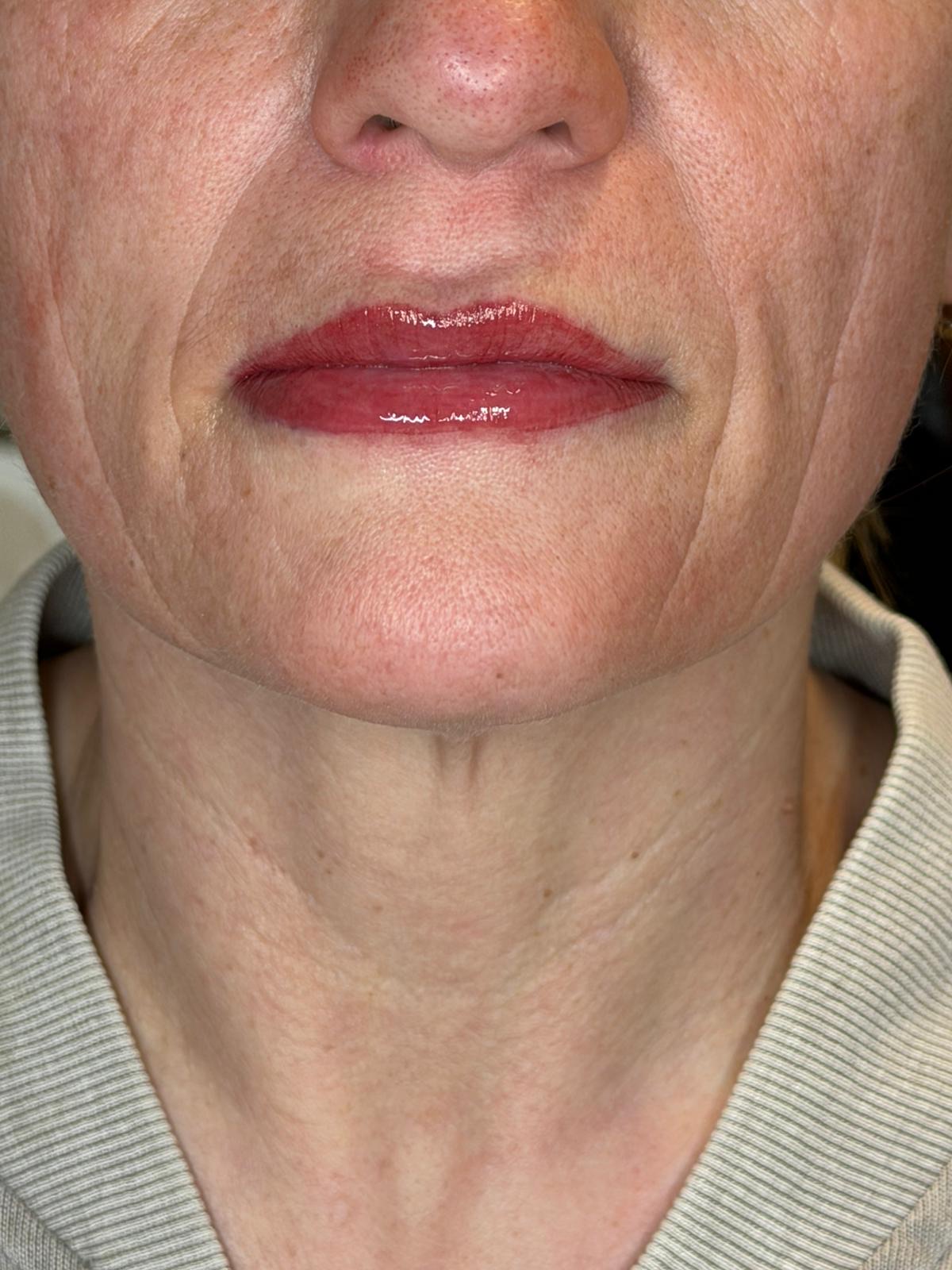 Soft, natural lip blush result on a mature client
