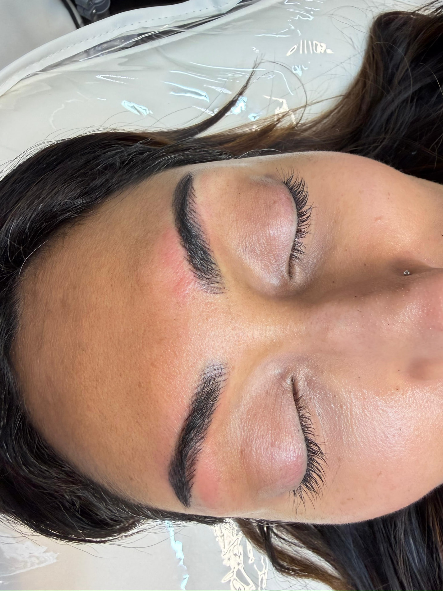 Close-up of ombre powder brows on a client